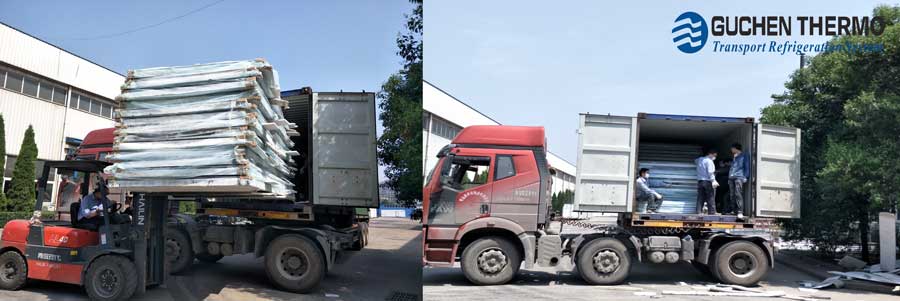 The workers are  loading the refrigeration truck body boards